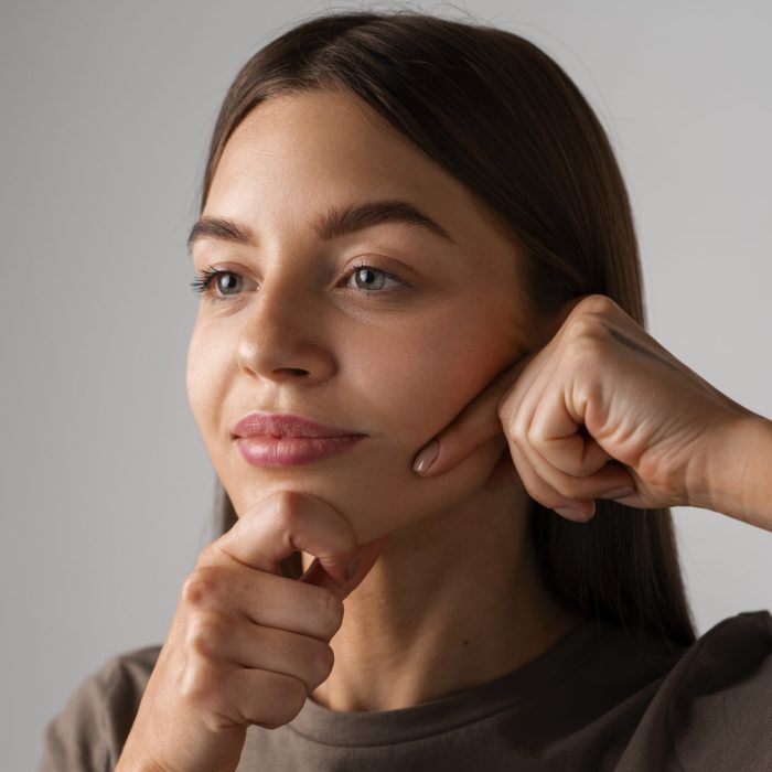 portrait-young-woman-practicing-facial-yoga-youth