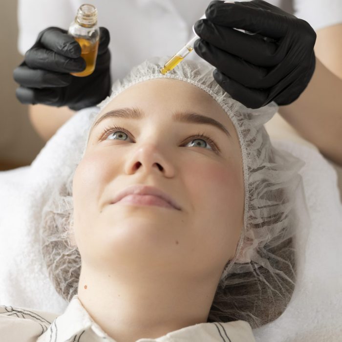 young-woman-getting-eyebrow-treatment-beauty-salon